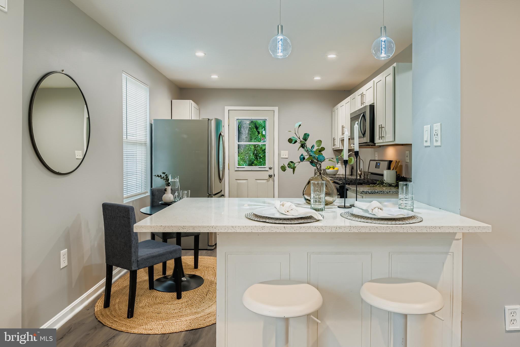 1229 North Point Road Dundalk, MD 21222 - Photo 9 of 28 a dining room with furniture and a mirror