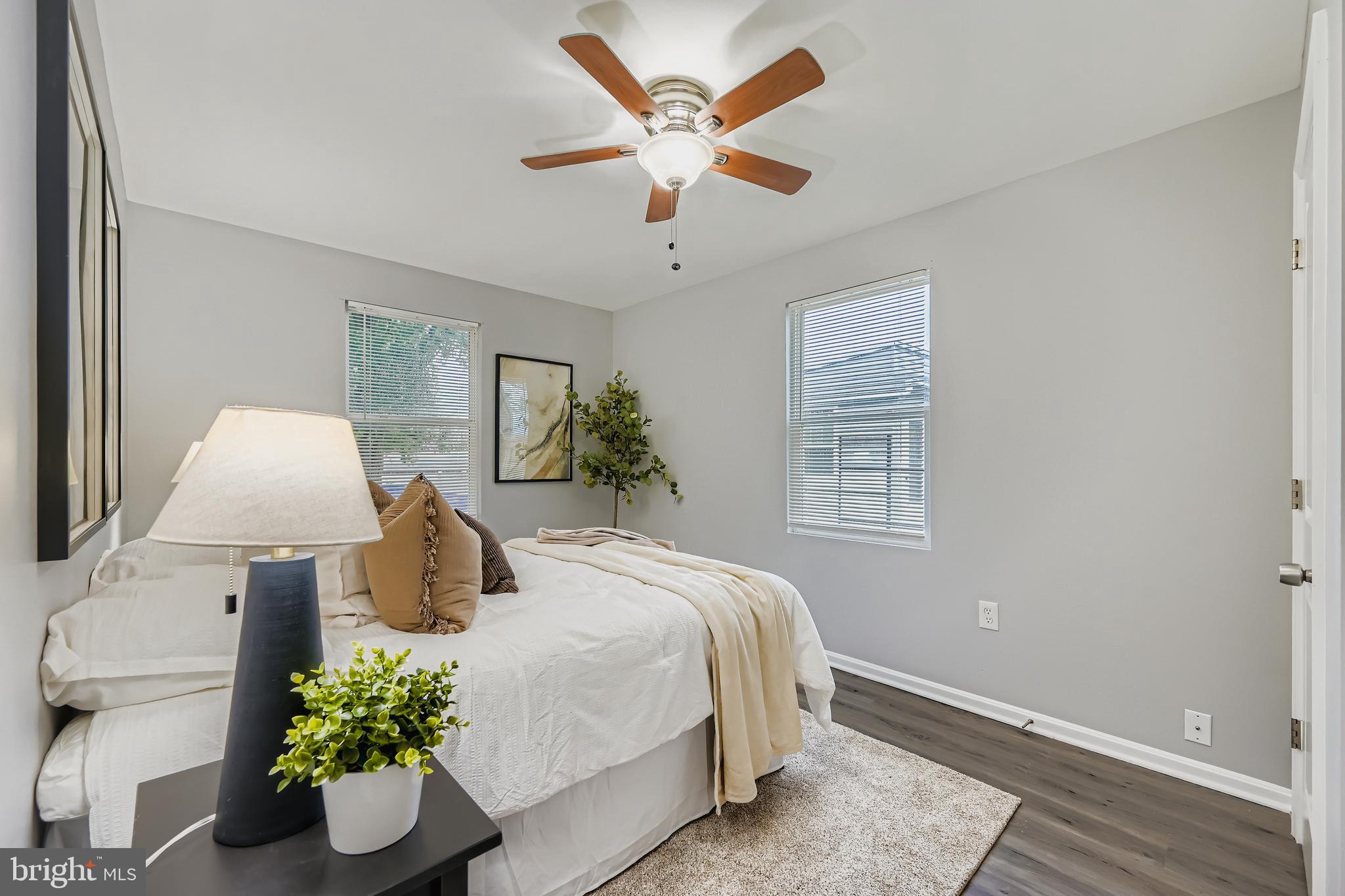 1229 North Point Road Dundalk, MD 21222 - Photo 10 of 28 a bedroom with a bed and a potted plant