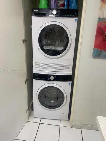 a kitchen with stainless steel appliances granite countertop a refrigerator sink and stove