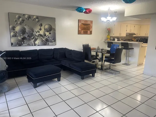 a view of a cars is parked in front of a house