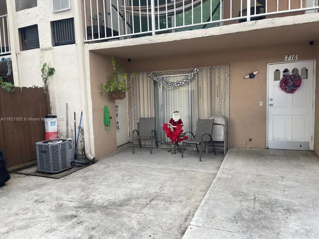 a view of a car parked in front of a house
