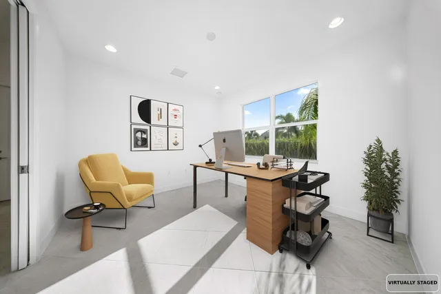 a living room with furniture and a chair