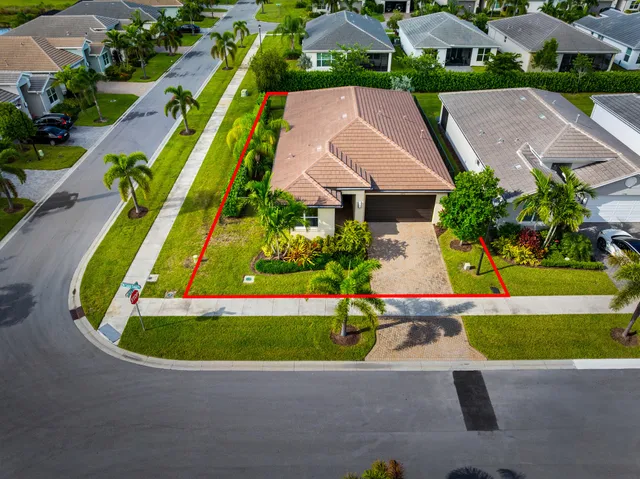 an aerial view of multiple houses with swimming pool