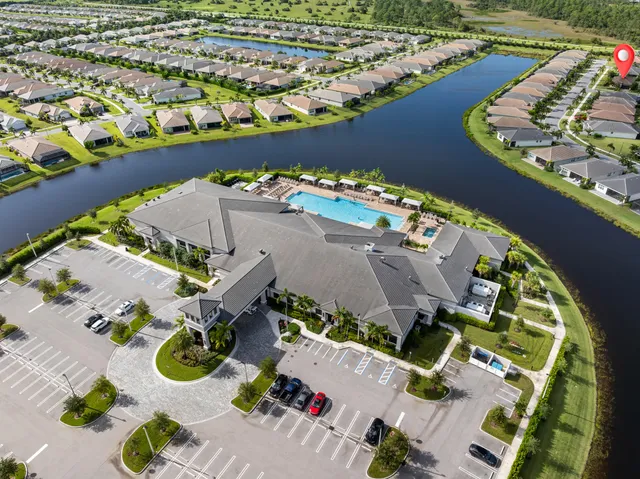 an aerial view of a house with yard swimming pool and outdoor seating