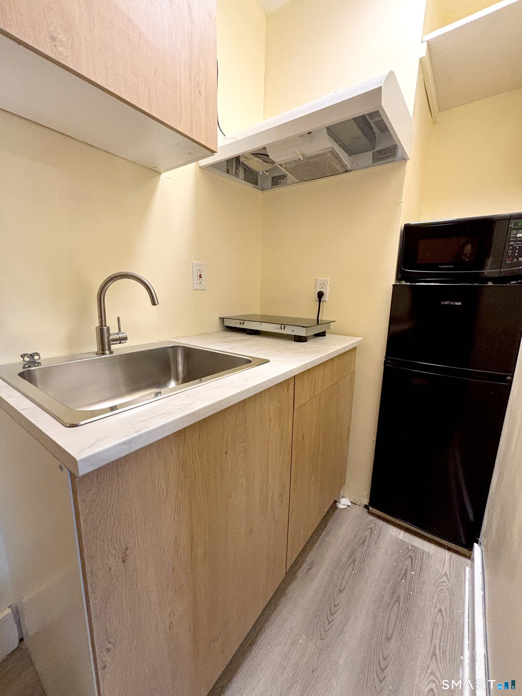 324 Curtis Street Meriden, CT 06450 - Photo 5 of 6 a kitchen with a sink and cabinets