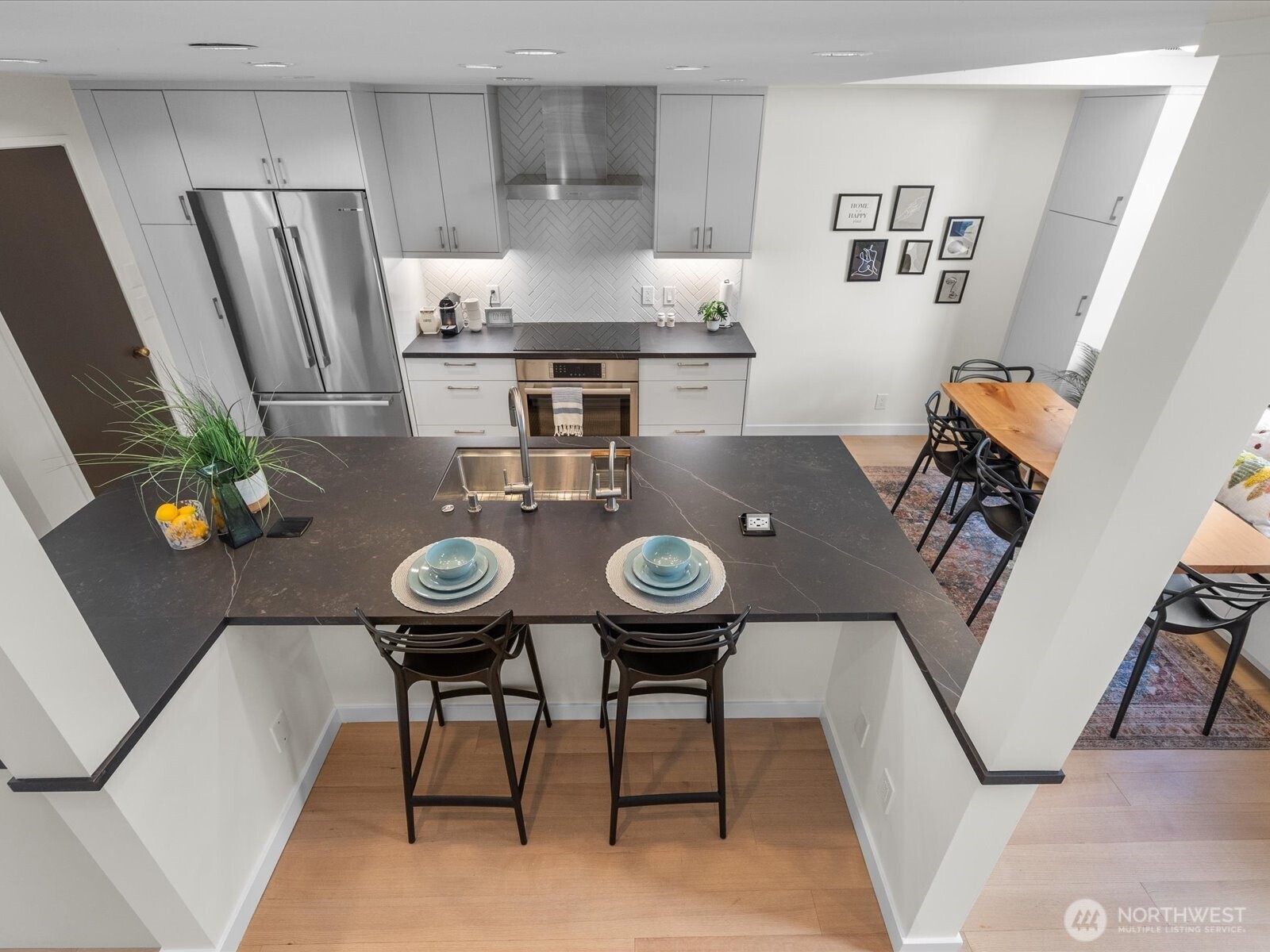 88 Virginia Street, Unit 3 Seattle, WA 98121 - Photo 14 of 40 a view of a dining room with furniture and wooden floor