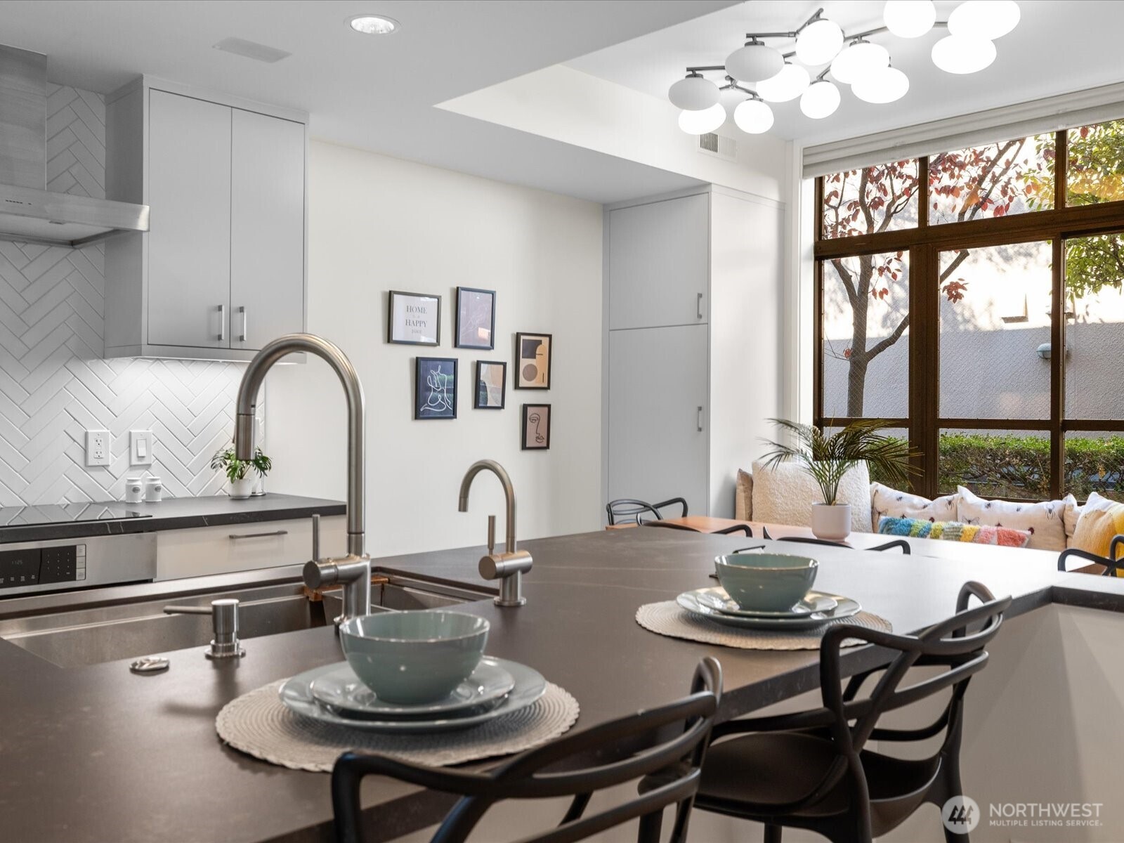 88 Virginia Street, Unit 3 Seattle, WA 98121 - Photo 15 of 40 a kitchen with a dining table and chairs