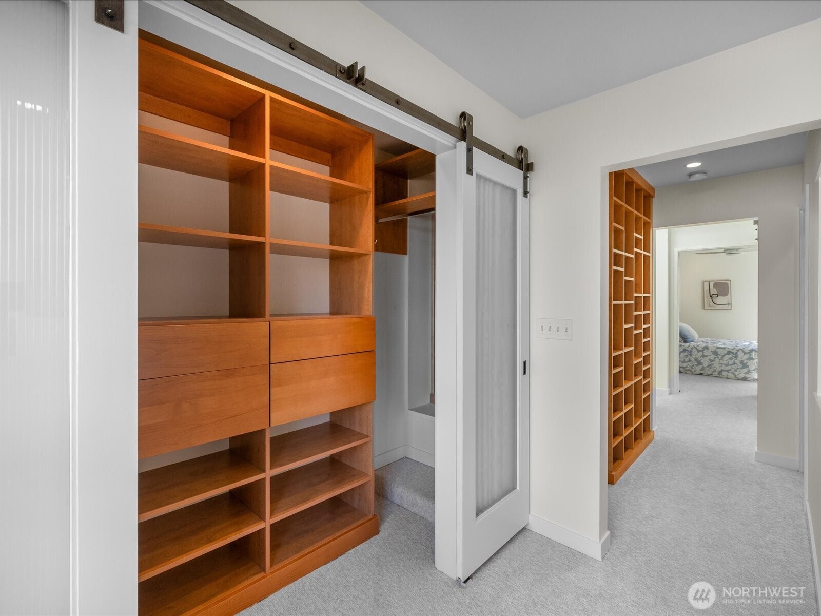 88 Virginia Street, Unit 3 Seattle, WA 98121 - Photo 18 of 40 a view of walk in closet with empty racks