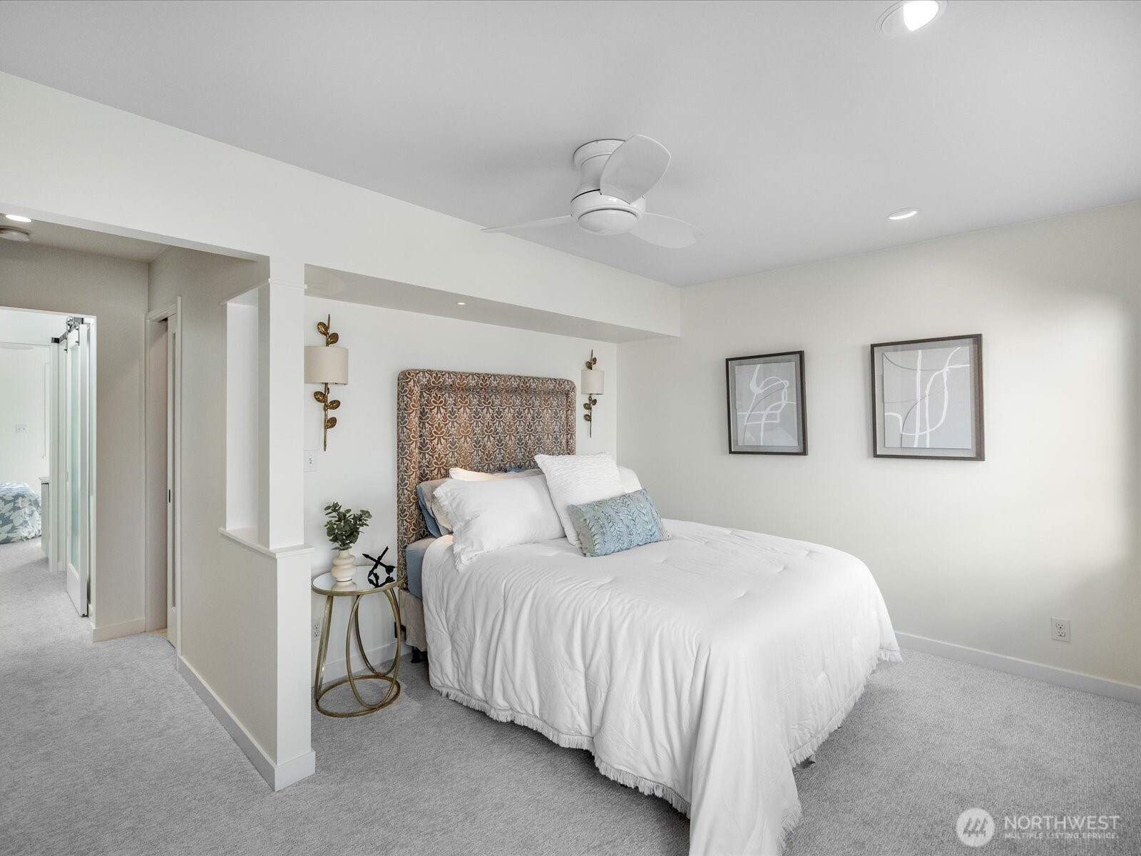 88 Virginia Street, Unit 3 Seattle, WA 98121 - Photo 20 of 40 a bedroom with a bed and a chandelier