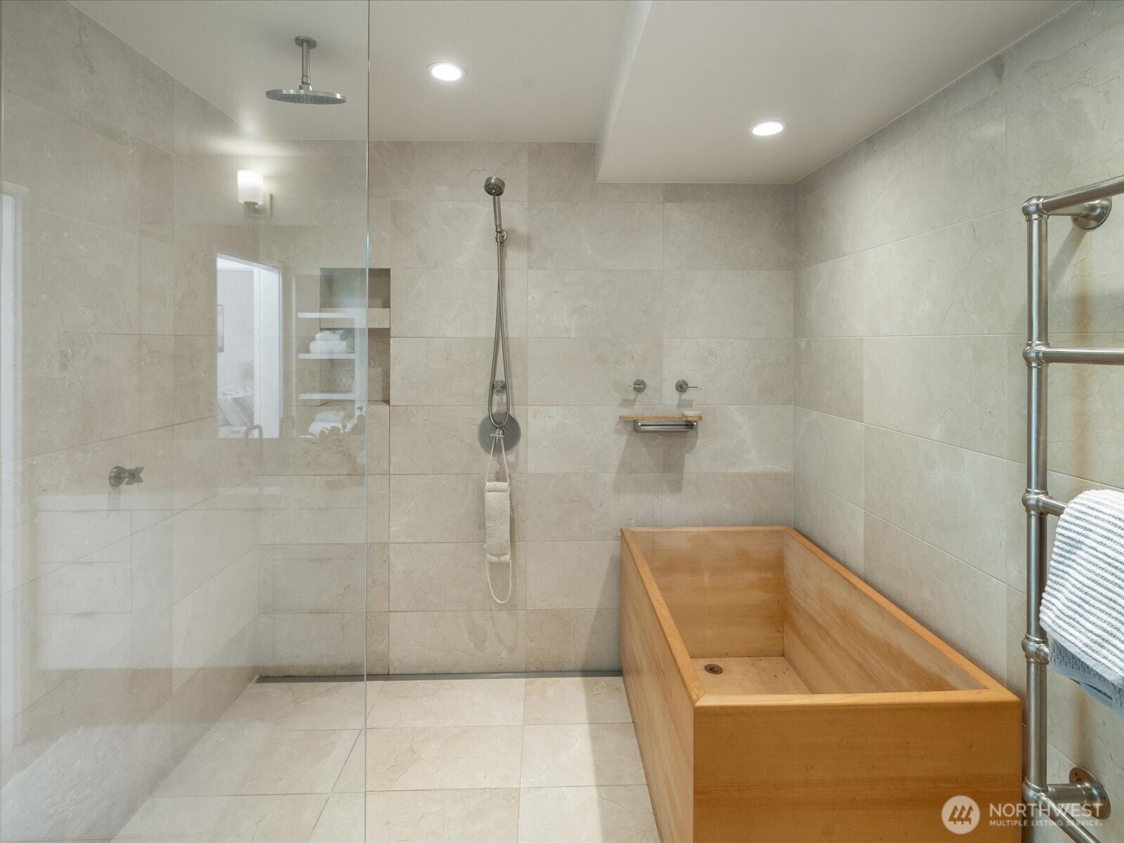 88 Virginia Street, Unit 3 Seattle, WA 98121 - Photo 21 of 40 a bathroom with a tub a window and a shower
