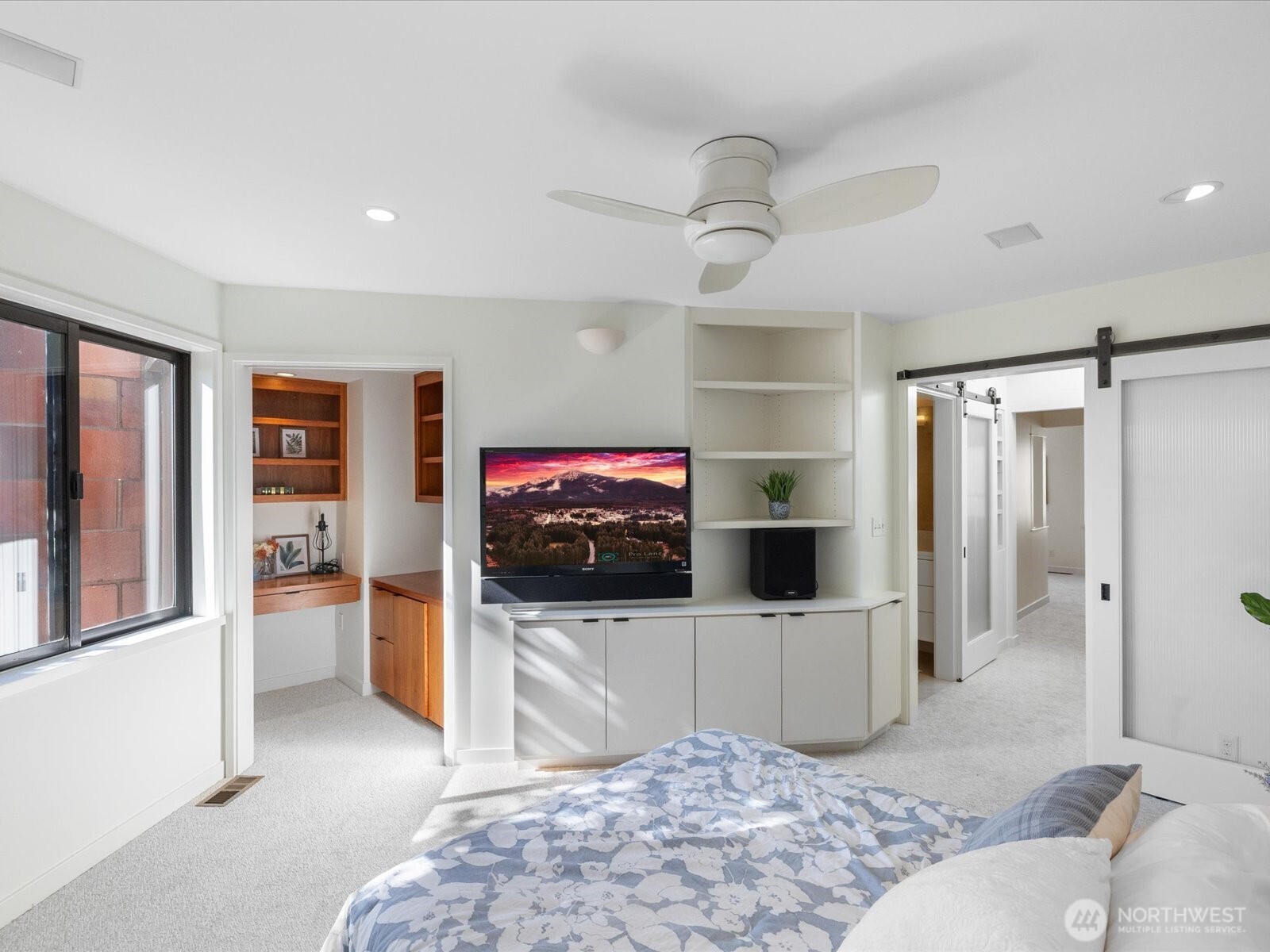 88 Virginia Street, Unit 3 Seattle, WA 98121 - Photo 26 of 40 a living room with a flat screen tv and a view of kitchen