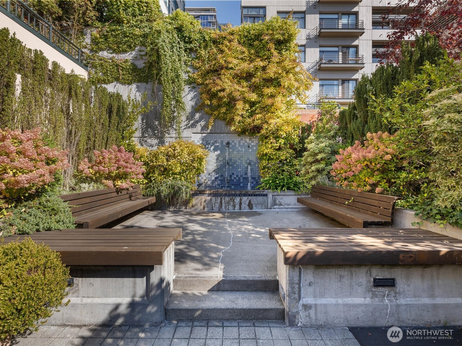 88 Virginia Street, Unit 3 Seattle, WA 98121 - Photo 33 of 40 a view of a patio with table and chairs and potted plants