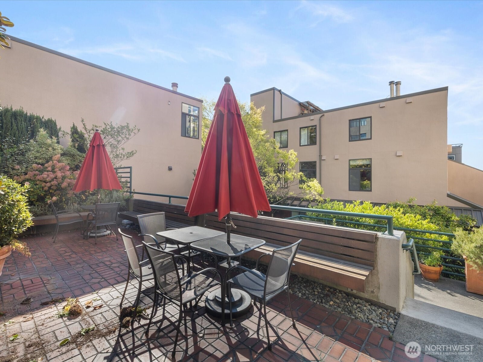 88 Virginia Street, Unit 3 Seattle, WA 98121 - Photo 35 of 40 a view of a patio with a table and chairs