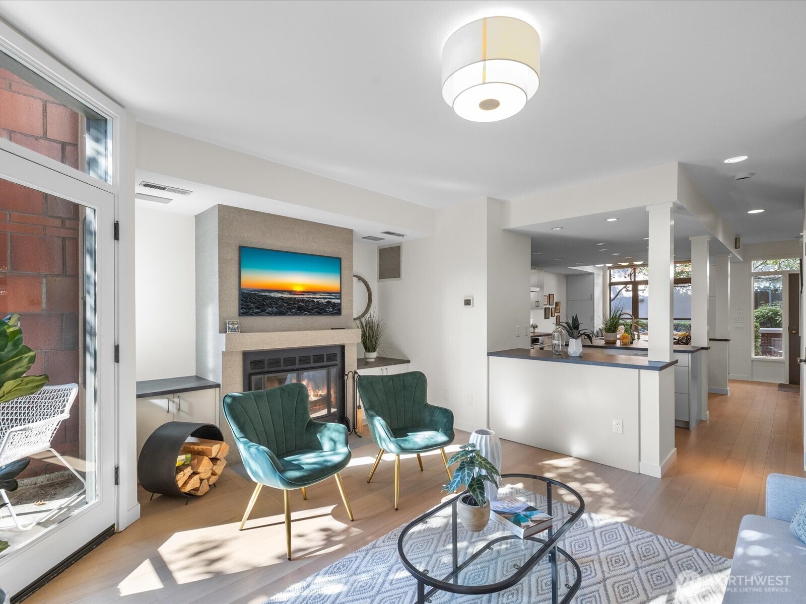 88 Virginia Street, Unit 3 Seattle, WA 98121 - Photo 7 of 40 a living room with furniture and a flat screen tv