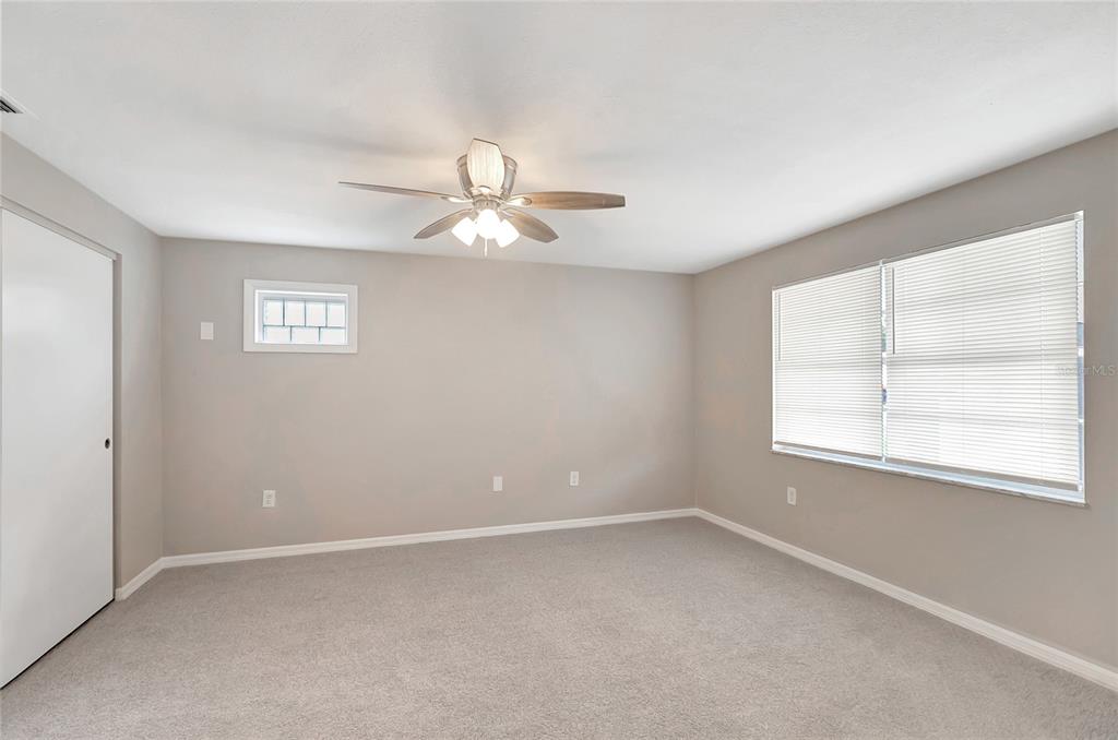 5900 Beech Street Zephyrhills, FL 33542 - Photo 18 of 37 an empty room with a window