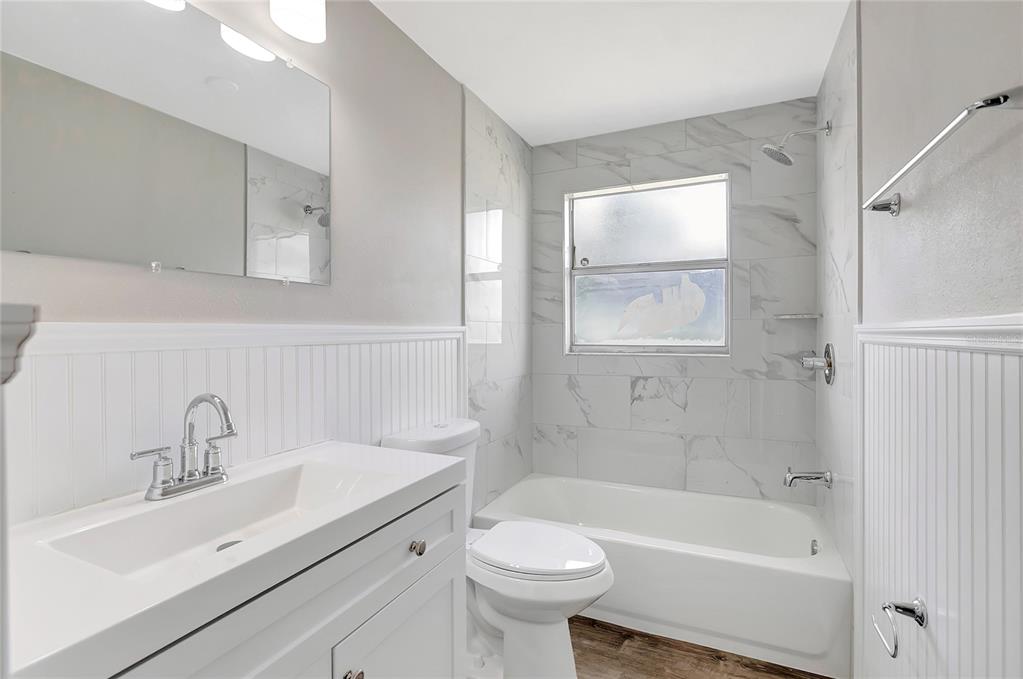 5900 Beech Street Zephyrhills, FL 33542 - Photo 28 of 37 a bathroom with a sink toilet and shower