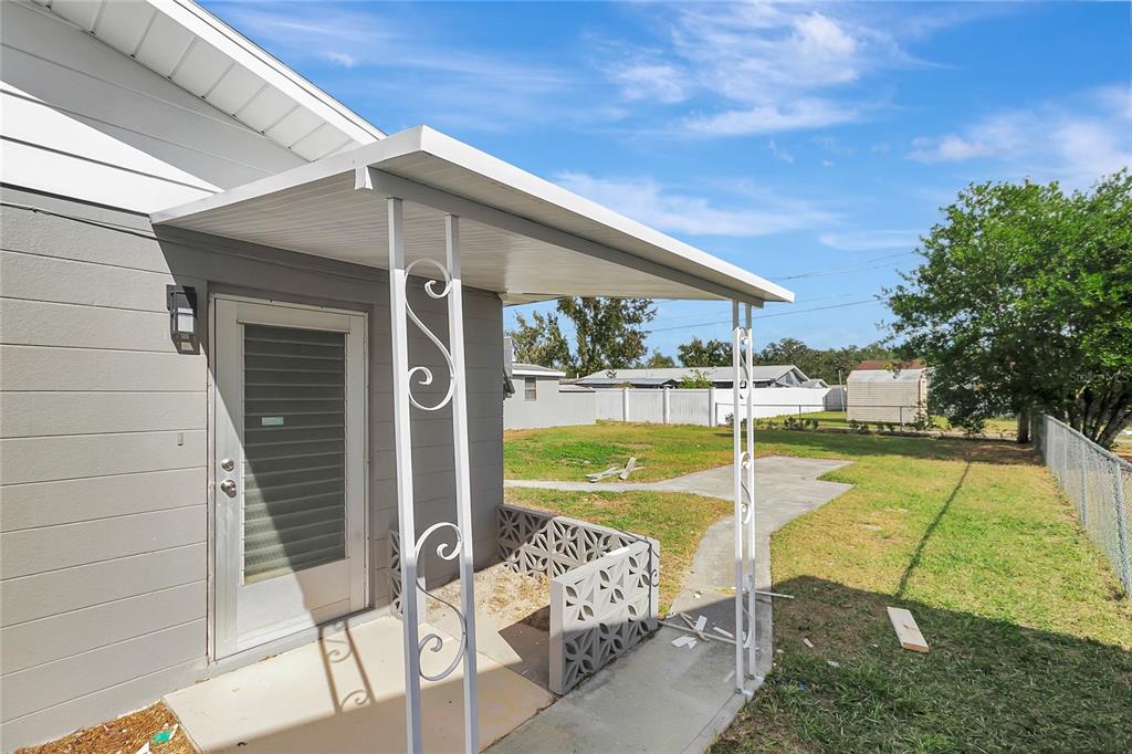 5900 Beech Street Zephyrhills, FL 33542 - Photo 34 of 37 a view of a swimming pool with a patio