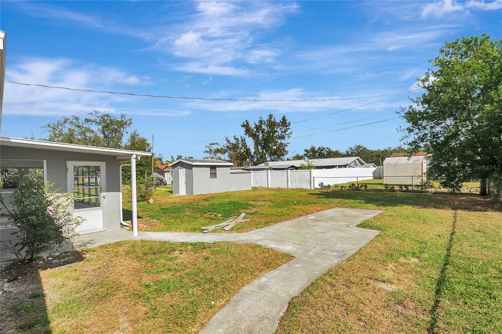 5900 Beech Street Zephyrhills, FL 33542 - Photo 35 of 37 a view of a house with a yard
