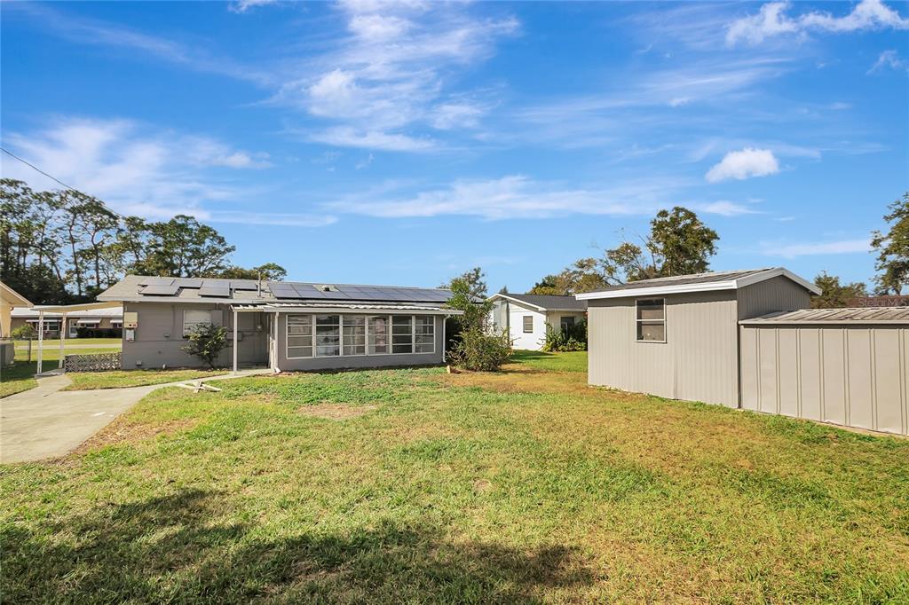 5900 Beech Street Zephyrhills, FL 33542 - Photo 37 of 37 a view of a house with a yard