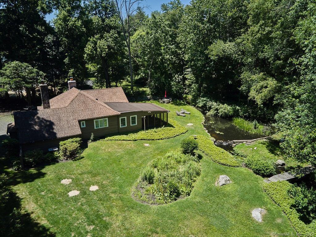 94 Partrick Road Westport, CT 06880 - Photo 17 of 17 a view of a house with a yard