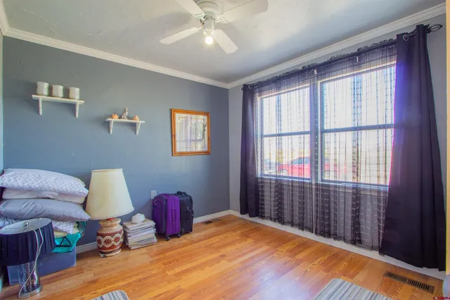 a bedroom with furniture and a window