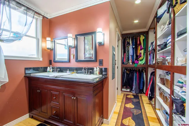 a hallway with a book shelf and a window