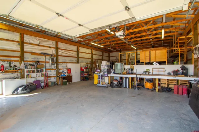 a view of a garage with a table and chairs