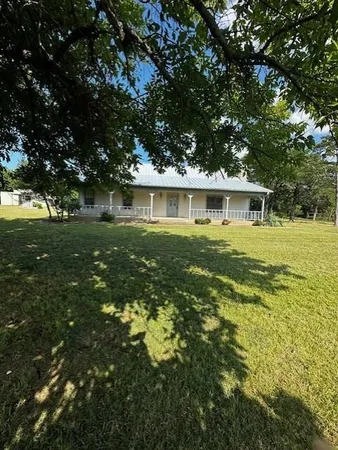 a view of a house with a big yard