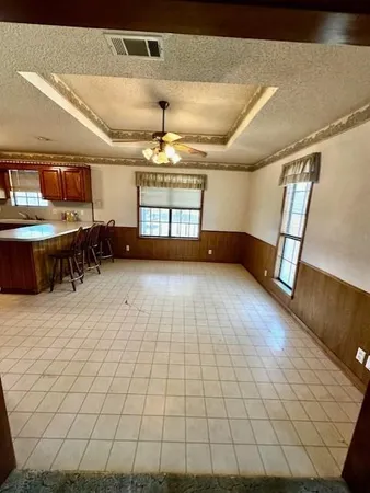 a view of a livingroom with furniture and chandelier