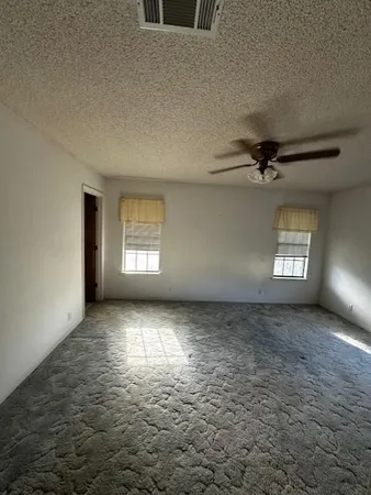 en empty room with windows