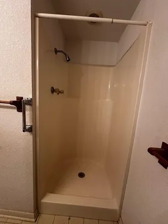a bathroom with a sink toilet and mirror