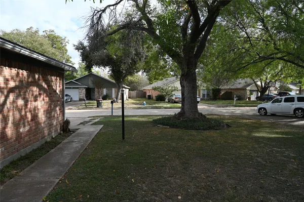 a view of street with parked cars