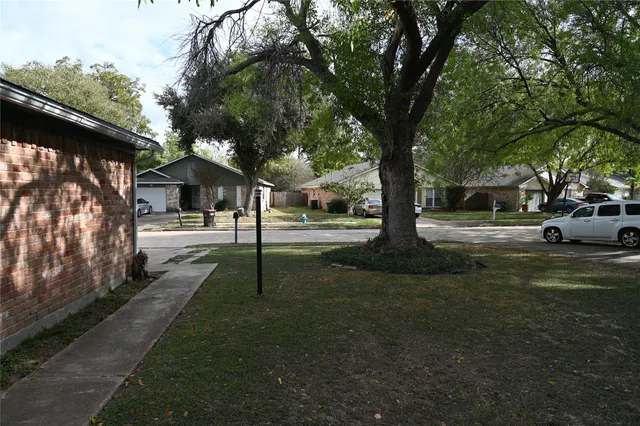 a view of street with parked cars