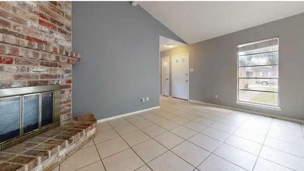 a view of an empty room and window