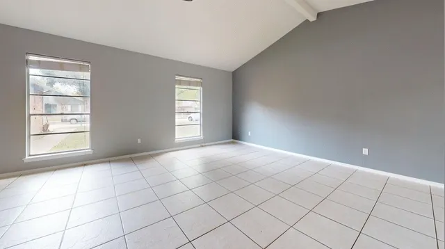a view of an empty room and window