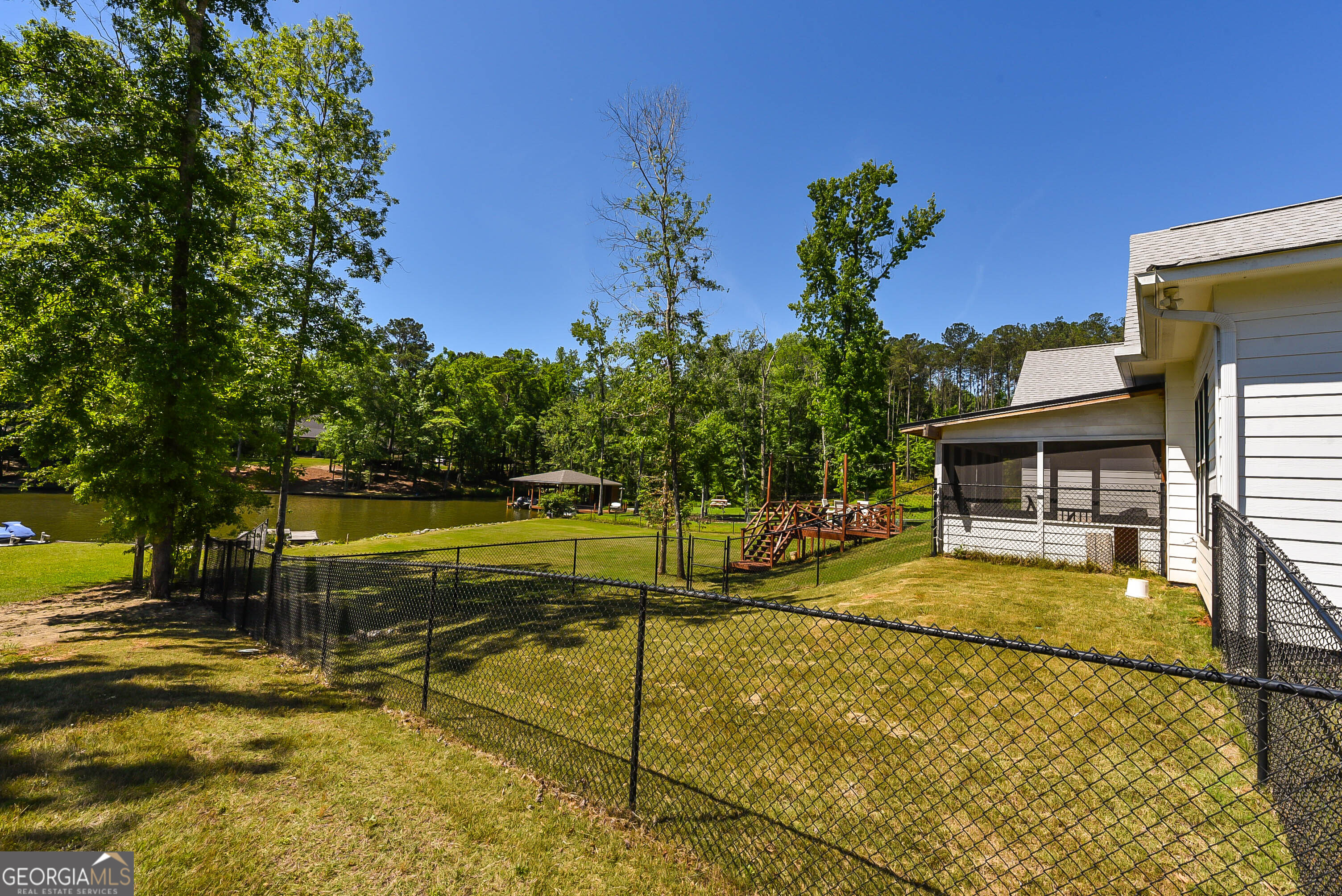 209 Lee Road Salem, AL 36874 - Photo 26 of 37 a view of a swimming pool with a lounge chairs