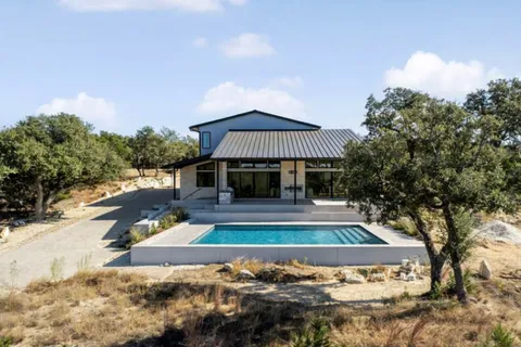a front view of a house with swimming pool