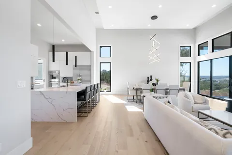 a kitchen with stainless steel appliances a stove sink and cabinets