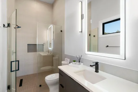 a bathroom with a bathtub and a shower