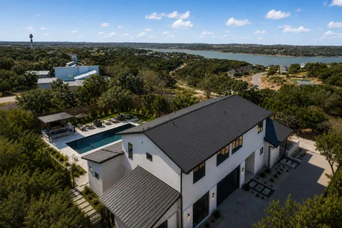 an aerial view of a house with a yard