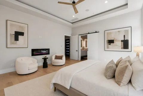 a bedroom with bed and window