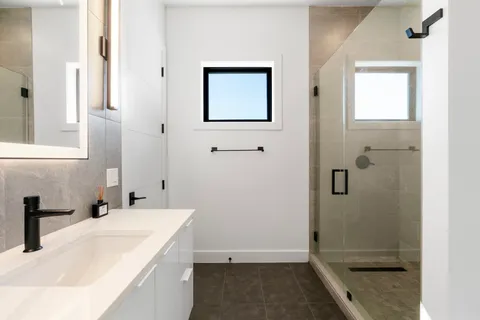 a bathroom with a sink and a mirror