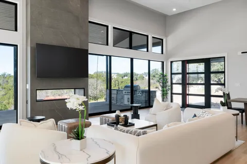 a living room with furniture and a large window
