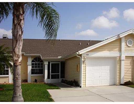 1050 Starkey Road, Unit 405 Largo, FL 33771 - Photo 1 of 1 front view of a house with a garden