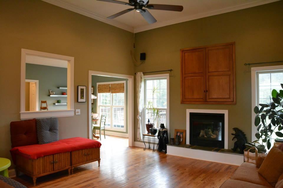 3121 New Ridge Road Elliston, VA 24087 - Photo 16 of 28 a living room with furniture a fireplace and a chandelier