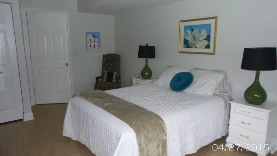 3121 New Ridge Road Elliston, VA 24087 - Photo 21 of 28 a bedroom with a bed and a lamp on the dresser