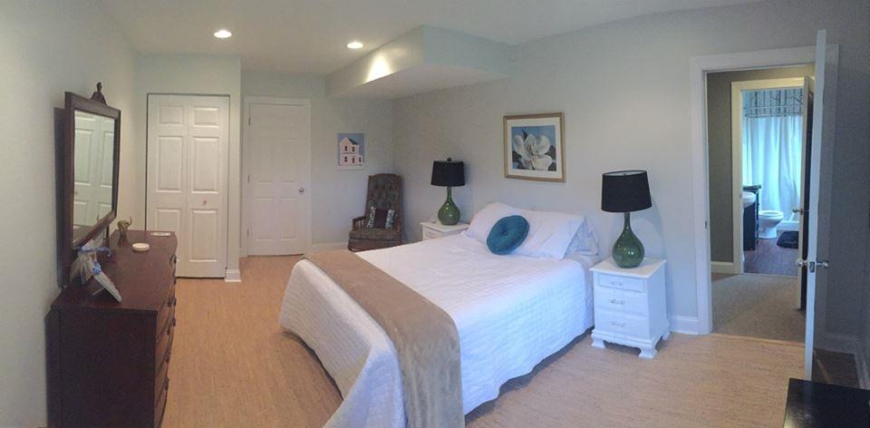 3121 New Ridge Road Elliston, VA 24087 - Photo 22 of 28 a bedroom with a bed and a large mirror