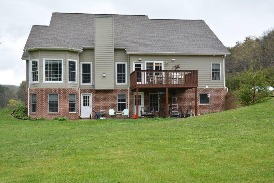 3121 New Ridge Road Elliston, VA 24087 - Photo 8 of 28 a view of a house with a yard and sitting area