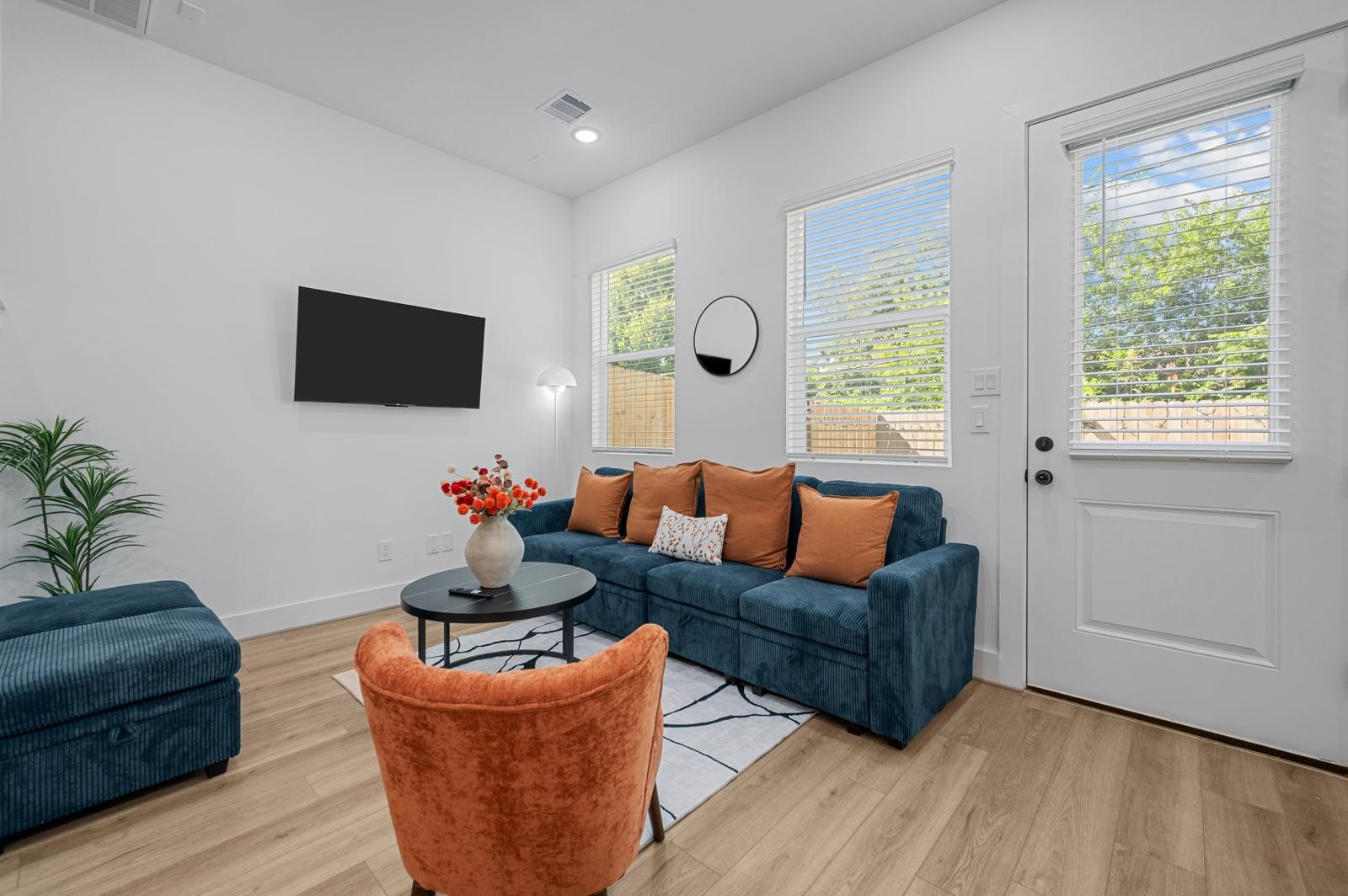 4201 Stassen Street Houston, TX 77051 - Photo 11 of 32 a living room with furniture a flat screen tv and a large window