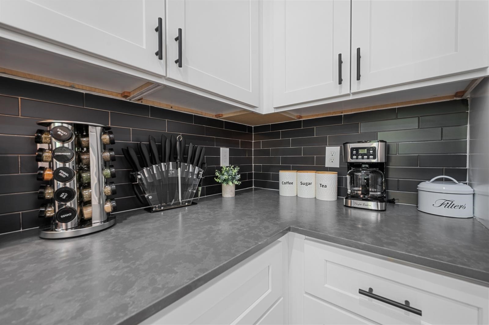 4201 Stassen Street Houston, TX 77051 - Photo 19 of 32 a kitchen with a refrigerator and cabinets